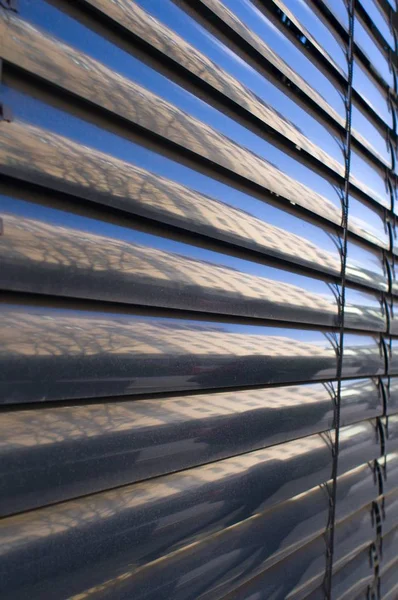 Reflecting metallic blinds — Stock Photo, Image