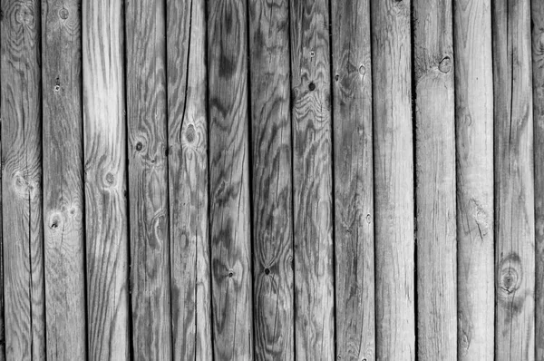 several uncoated wooden palisades