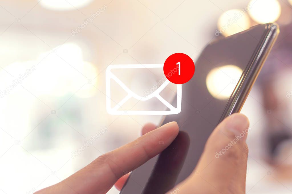 Woman hand use smartphone in public area with 1 new email alert sign icon pop up. Communication business technology.