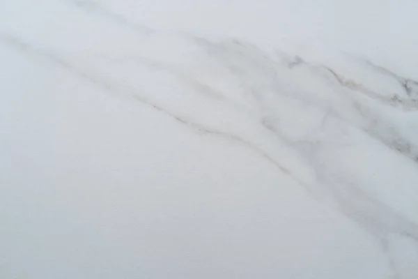 Ovanifrån av vit marmor konsistens abstrakt bakgrund. — Stockfoto