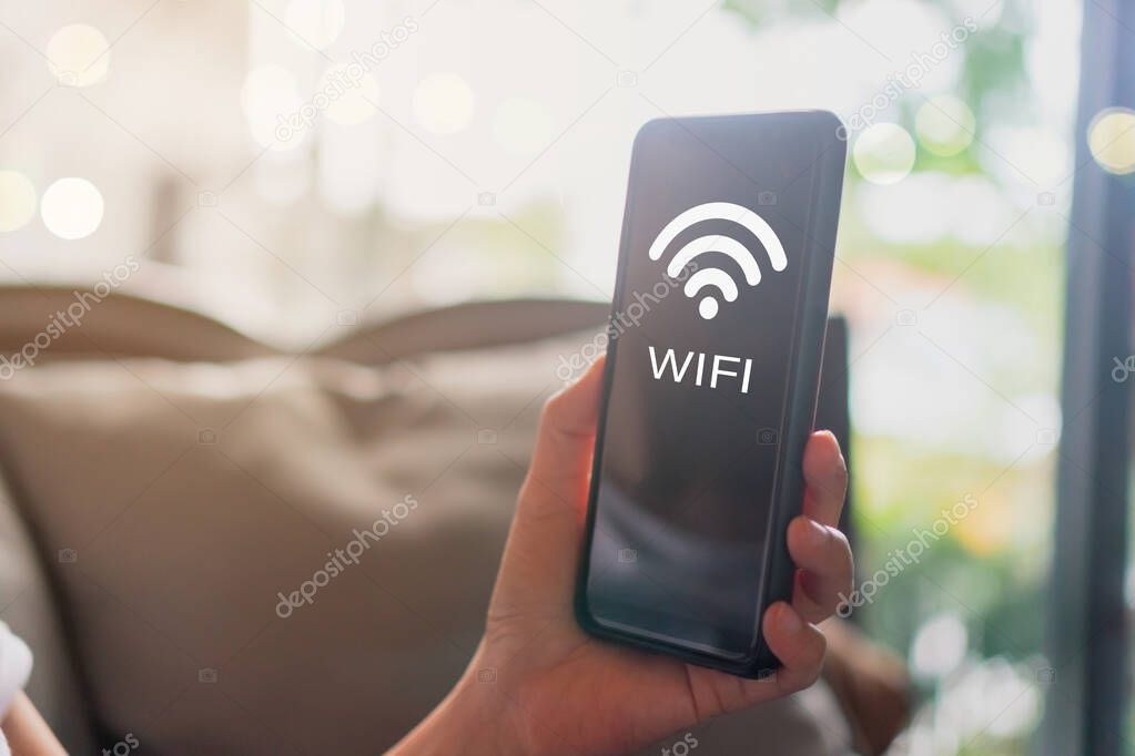 Wifi sign icon and connection screen of smartphone with top view city background. Financial business technology freedom dream life using internet freedom life concept.