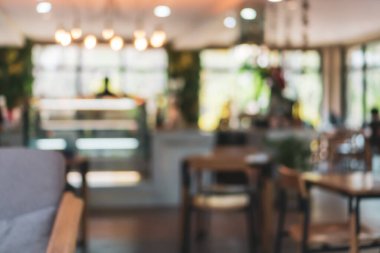 Bulanık kahve ve müşterilerin arka plan vintage ton renk tarzına sahip dinlendirici kafe.