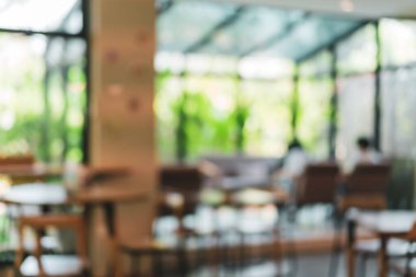 Bulanık kahve ve müşterilerin arka plan vintage ton renk tarzına sahip dinlendirici kafe.