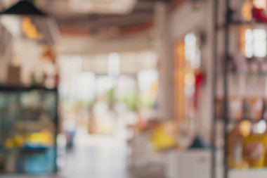 Bulanık kahve ve müşterilerin arka plan vintage ton renk tarzına sahip dinlendirici kafe.