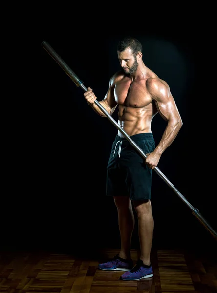 Gym iron bar as a spear. — Stock Photo, Image