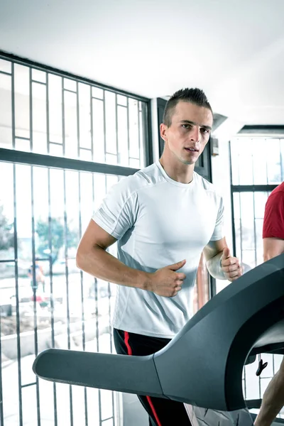 Man running on treadmill — Stock Photo, Image