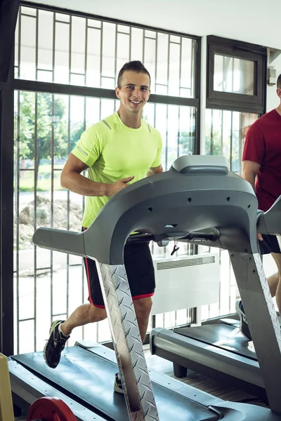 Two Men running on treadmill — Stock Photo, Image