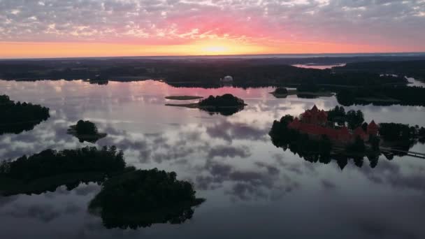 Aerial flight view Trakai Island Castle in front of a sunrise — 비디오