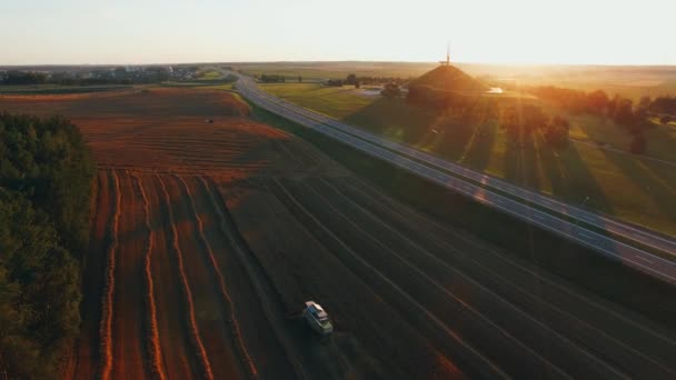 Combine Harvesting autumn red Field in Sunset. Agriculture food production, harvest concept. — Stockvideo