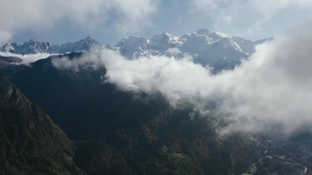 The flight in clouds above beautiful mountains — 비디오