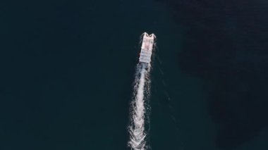 Aerial view of a catamaran, speed boat or yacht sailing in the Cyprus sea
