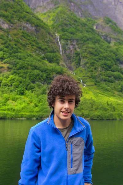 : Portrait of happy boy in green nature in Norway