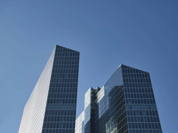 Two high-rise buildings with glass facade Royalty Free Stock Images