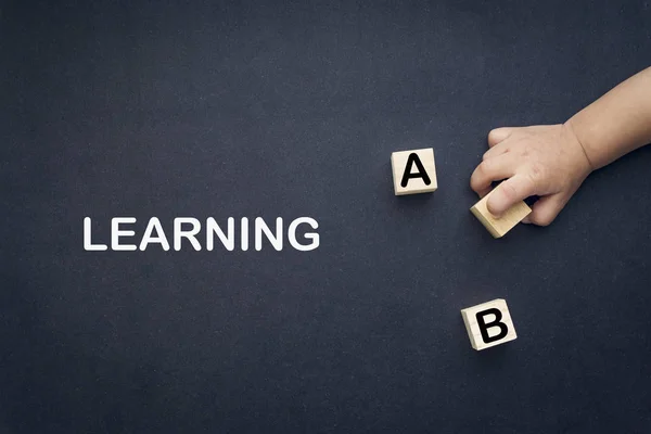 Learn Alphabet Words Learning Wooden Cube Children Hands Black Background — Stock Photo, Image