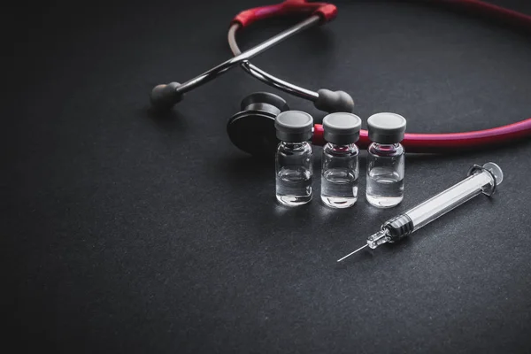 Stethoscope Vials Syringe Black Background Selective Focus Copy Space — Stock Photo, Image