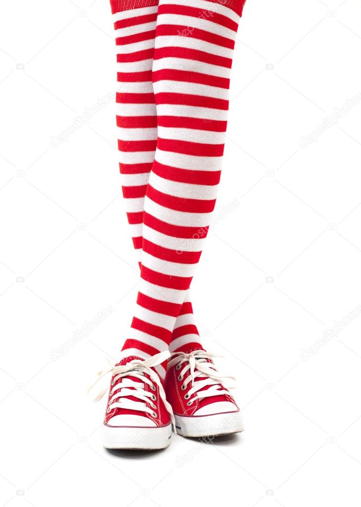 Woman legs in socks on white background