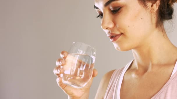 Young woman drinking  water — Stock Video