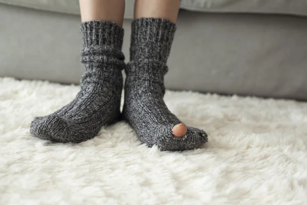 Woman leg in rip sock