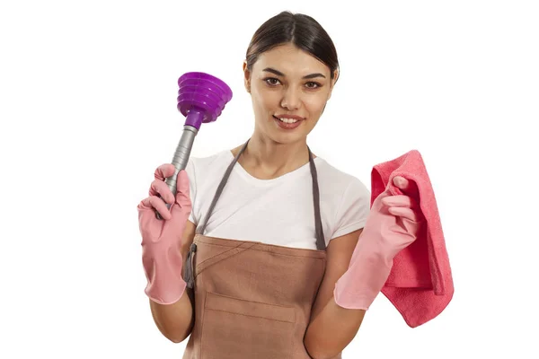 Young woman with cleaning supplies on white background — Stock Photo, Image