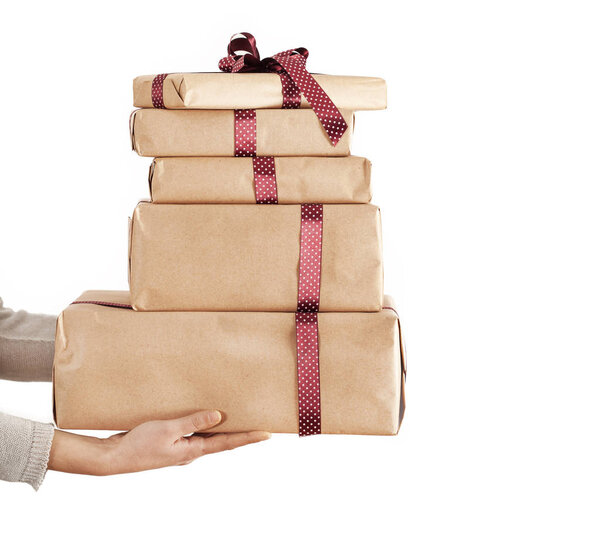 Woman hands gives gift in boxes
