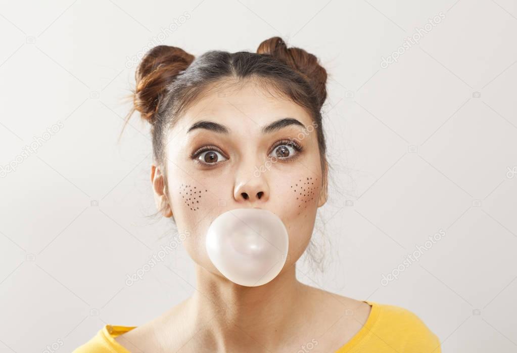 Portrait woman with bubble of gum