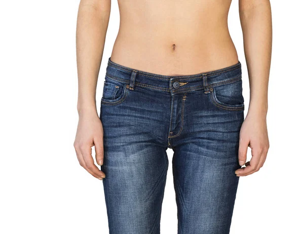 Vista de cerca del vientre de la mujer y jeans —  Fotos de Stock