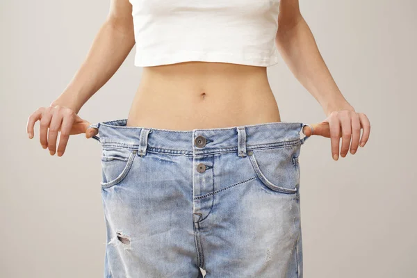 Weight loss woman with bluejeans — Stock Photo, Image
