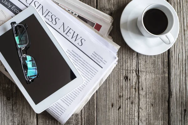 Newspaper on wooden table — Stock Photo, Image