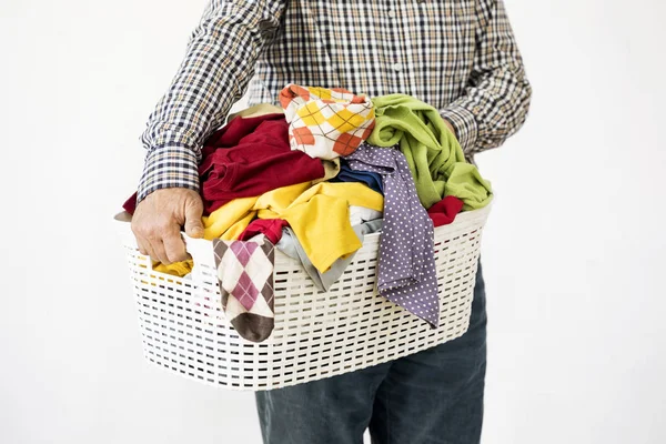 Man hands holding laundry basket — Stok Foto
