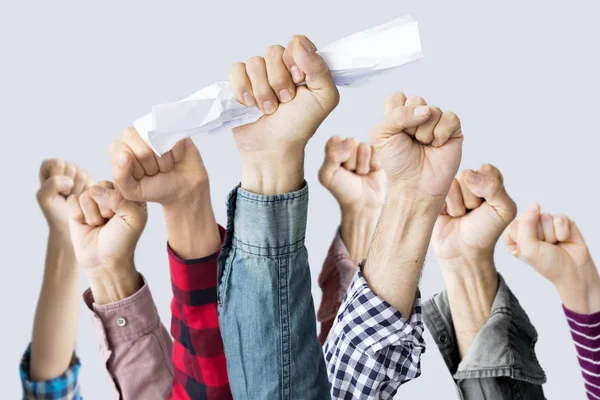 Pessoas levantando os punhos — Fotografia de Stock