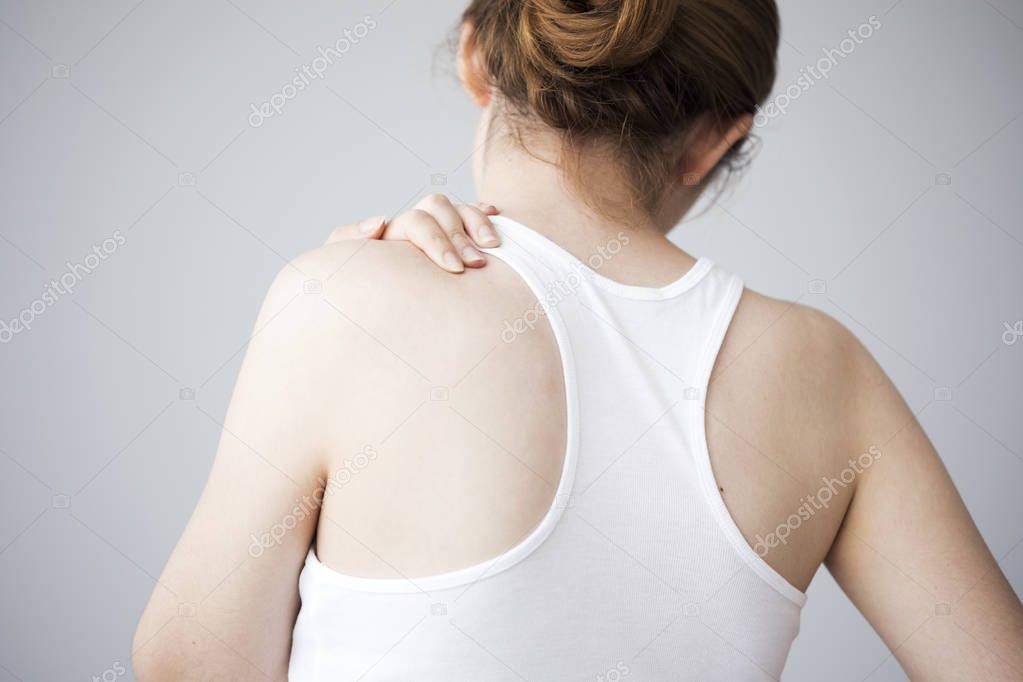 Young woman with neck ache