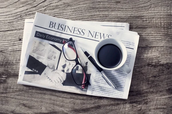 stock image Newspaper on wooden table