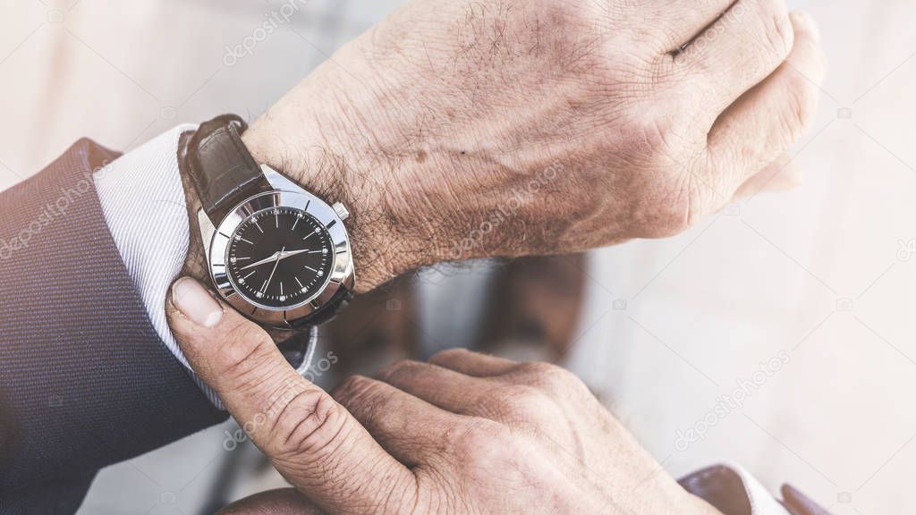 Man checking time his watch