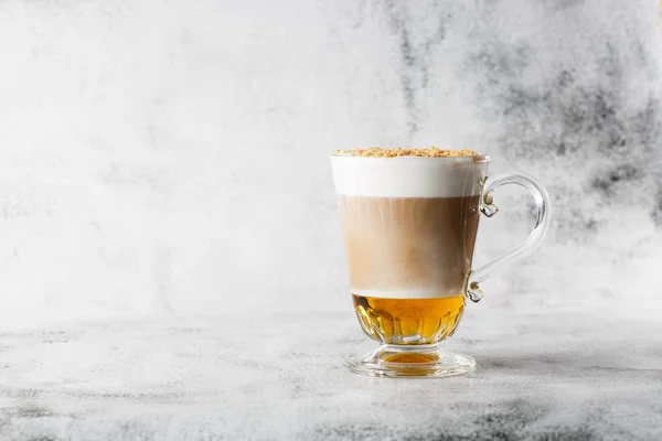 Coffee with Irish whiskey and whipped cream in glass isolated on bright marble background. Overhead view, copy space. Advertising for cafe menu. Coffee shop menu. Horizontal photo.