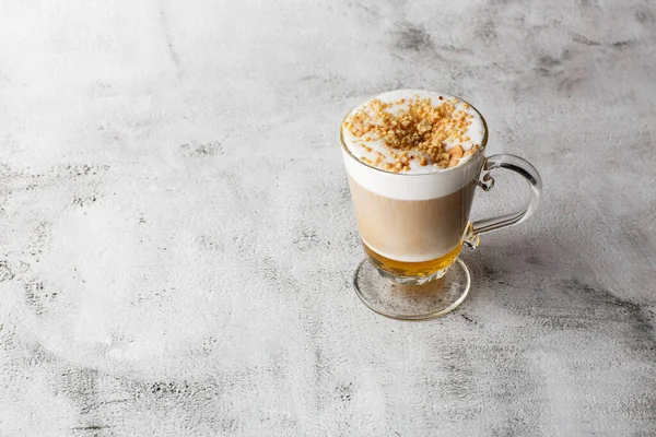 Coffee with Irish whiskey and whipped cream in glass isolated on bright marble background. Overhead view, copy space. Advertising for cafe menu. Coffee shop menu. Horizontal photo.