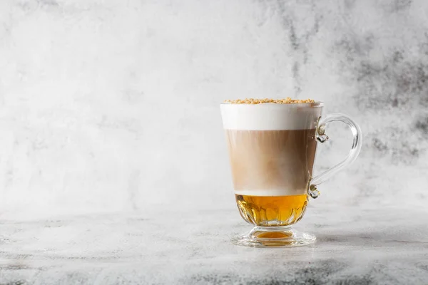 Coffee with Irish whiskey and whipped cream in glass isolated on bright marble background. Overhead view, copy space. Advertising for cafe menu. Coffee shop menu. Horizontal photo.