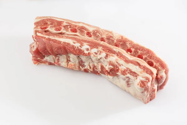 Pork belly isolated on white background. Top view. fresh ribs isolated on white background. With clipping path. Raw meat, farm and cooking concept. Meat shop. — Stock Photo, Image