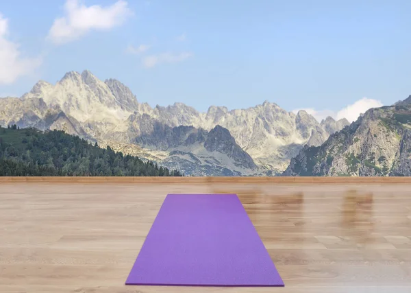 Yoga mat on the wooden floor — Stock Photo, Image