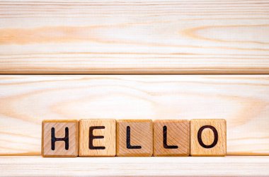 Hello word concept. The word Hello on wooden cubes. Hello background. Hello invitation. Hello background. Greeting hello. Wooden background. Meeting, salutation, salute, welcome concept