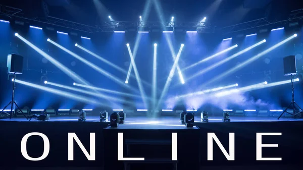 Concert live streams available online. Online concert during quarantine. Background for online concert. Blue stage spotlights. Empty stage with blue spotlights. Online COVID-19 concert