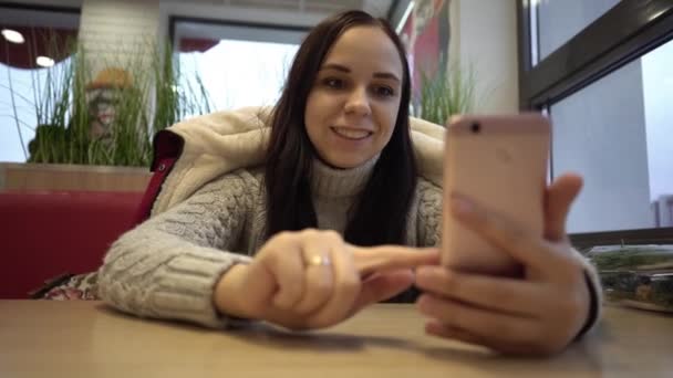 Young Beautiful Woman Conducts Live Broadcast Her Mobile Phone Sitting — Stock Video