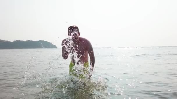 Attractive Man Sea Having Fun Splashing Water — Video