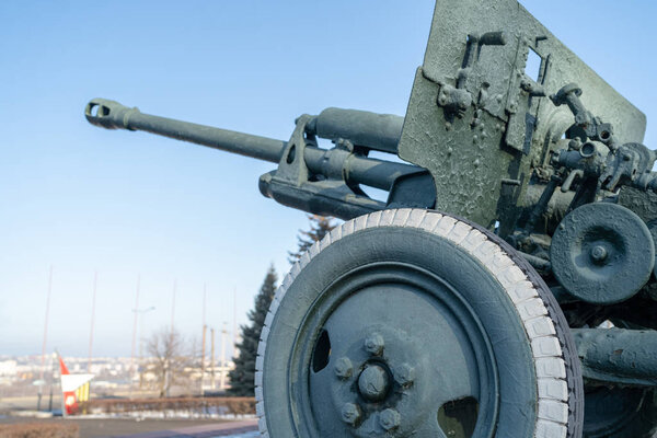Anti tank gun in military park. Old anti tank cannon monument mounted on pedestal on winter day in military park
