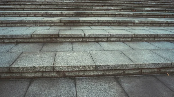 Texture of concrete steps. Stone staircase in centre of city. Outdoor stone steps background texture made of multitude slab.