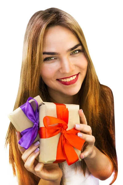 Beautiful young woman with gifts with red and purple ribbons — Stock Photo, Image