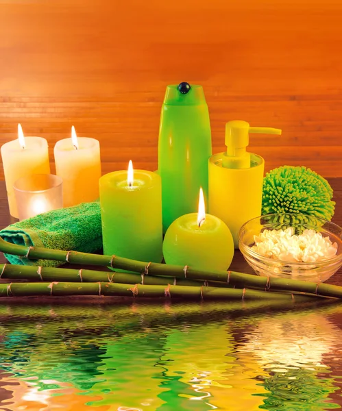 Macro view of green spa bath products concept with candles, flow — Stock Photo, Image