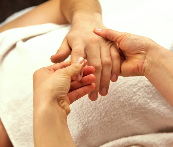 Hand massage with white towel — Stock Photo, Image
