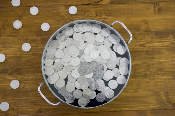 Silver coins in old pot
