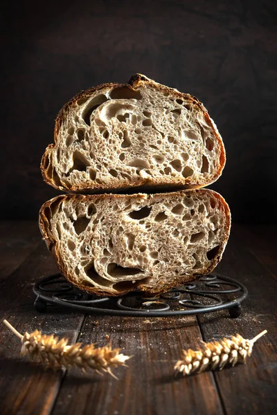 Open crumb basic sourdough bread cut in half