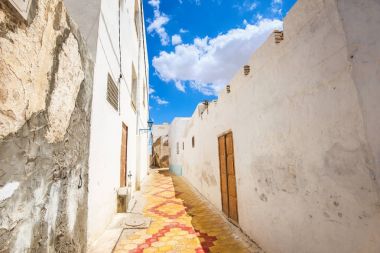 Cityscape with narrow street in Medina of Kairouan. Tunisia, North Africa     clipart